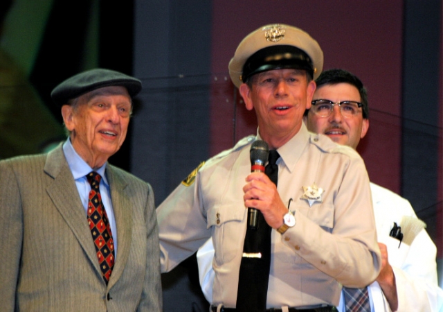 Don Knotts, David 'Mayberry Deputy' Browning, and Allan 'Floyd' Newsome on stage at the Grand Old Opry.